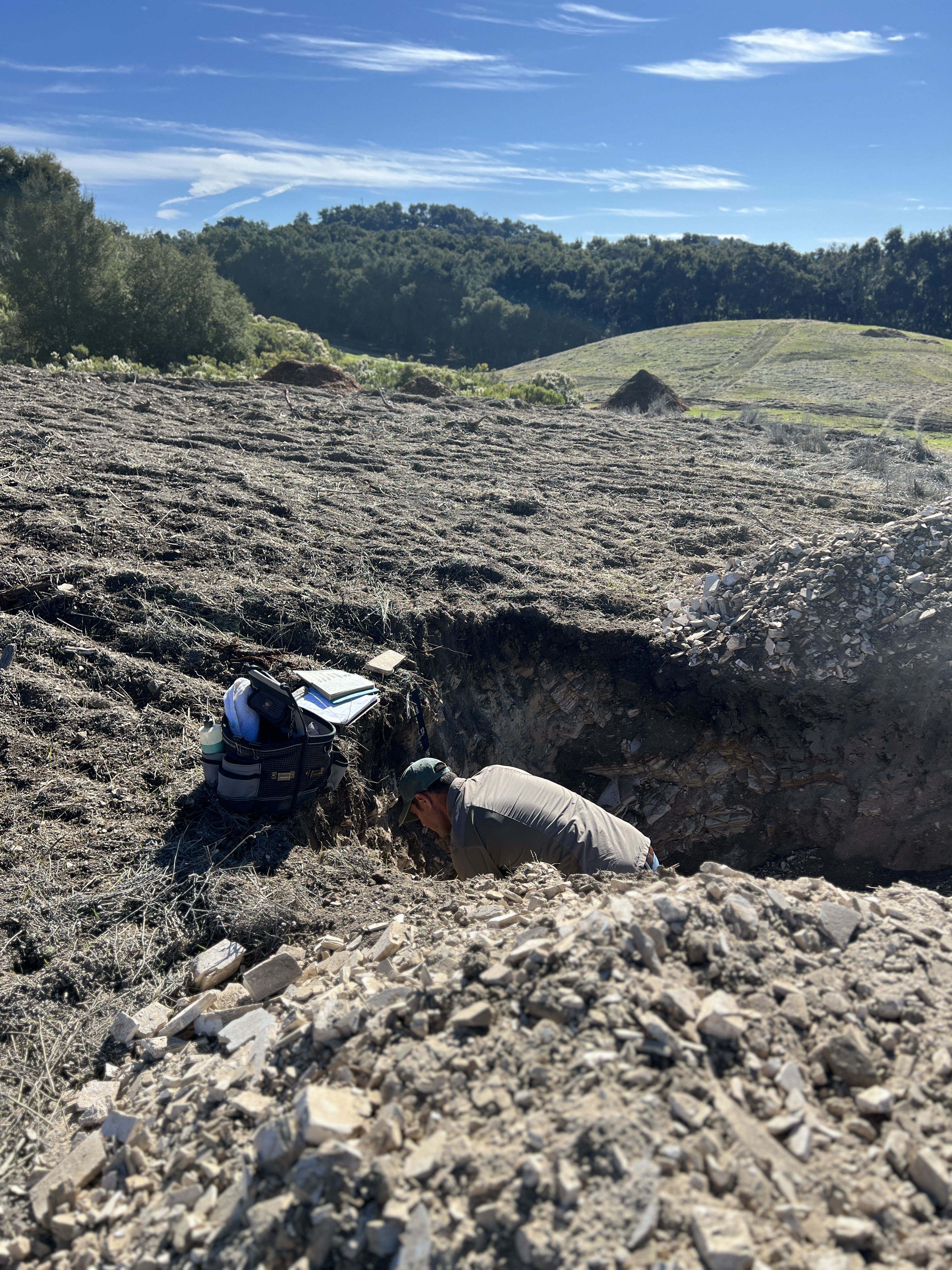 Steve Vierra examining soil profile in the field